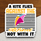 A Kite Flies Against the Wind Not With It Sticker